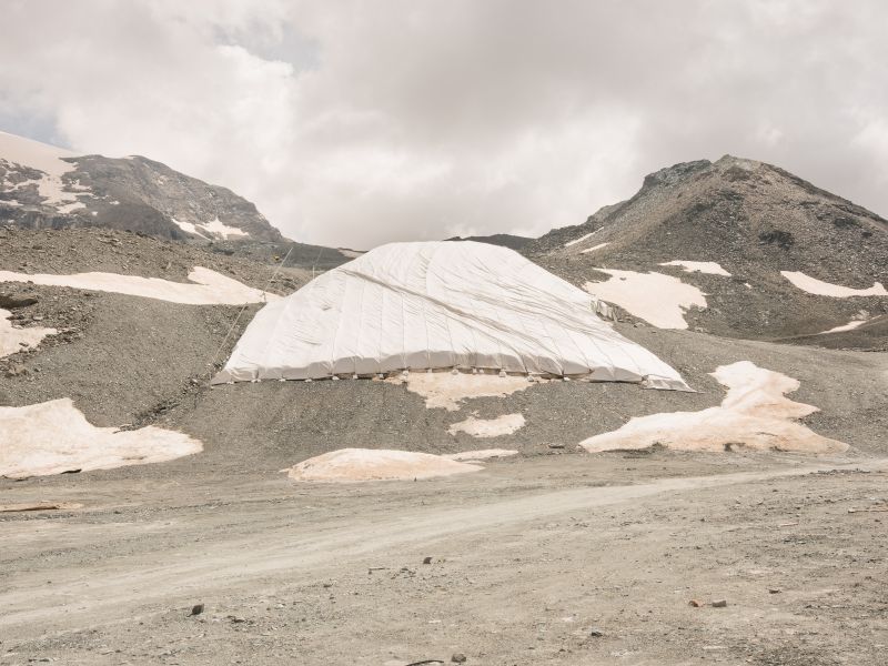 Tarpaulins on the snow from the previous season. From the serie Alpine hiatus, snow no longer tastes like snow - a Photographic Art by Filippo Poli